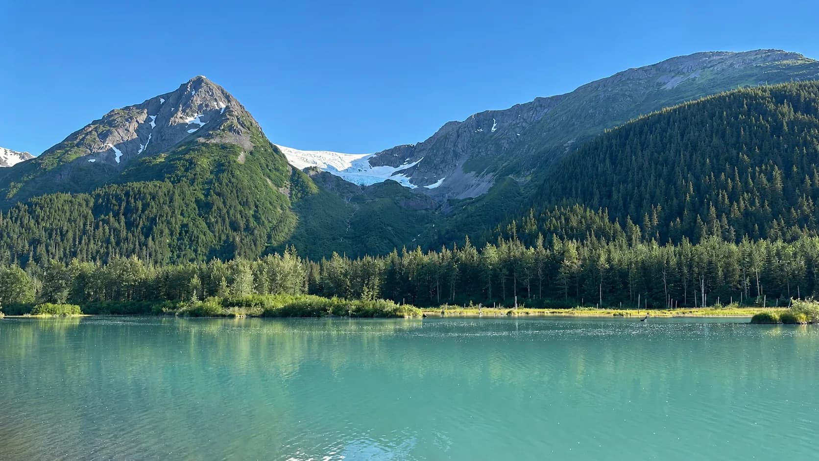 A glacial pond and mountains in Portage Valley